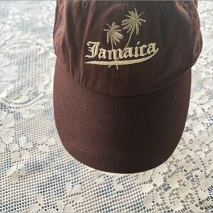 Brown baseball cap words, Jamaica on it